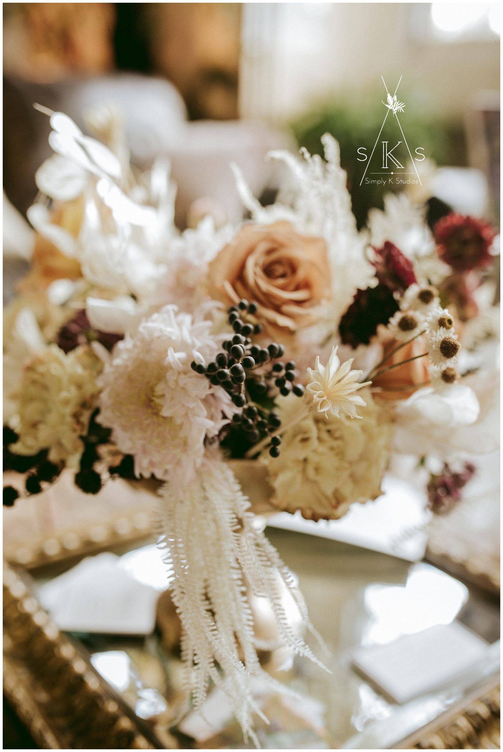  bouquet of dried and fresh flowers on a mirror tray 