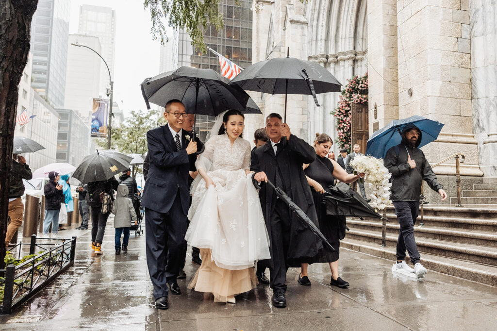 bride walking down a rainy street in NYC