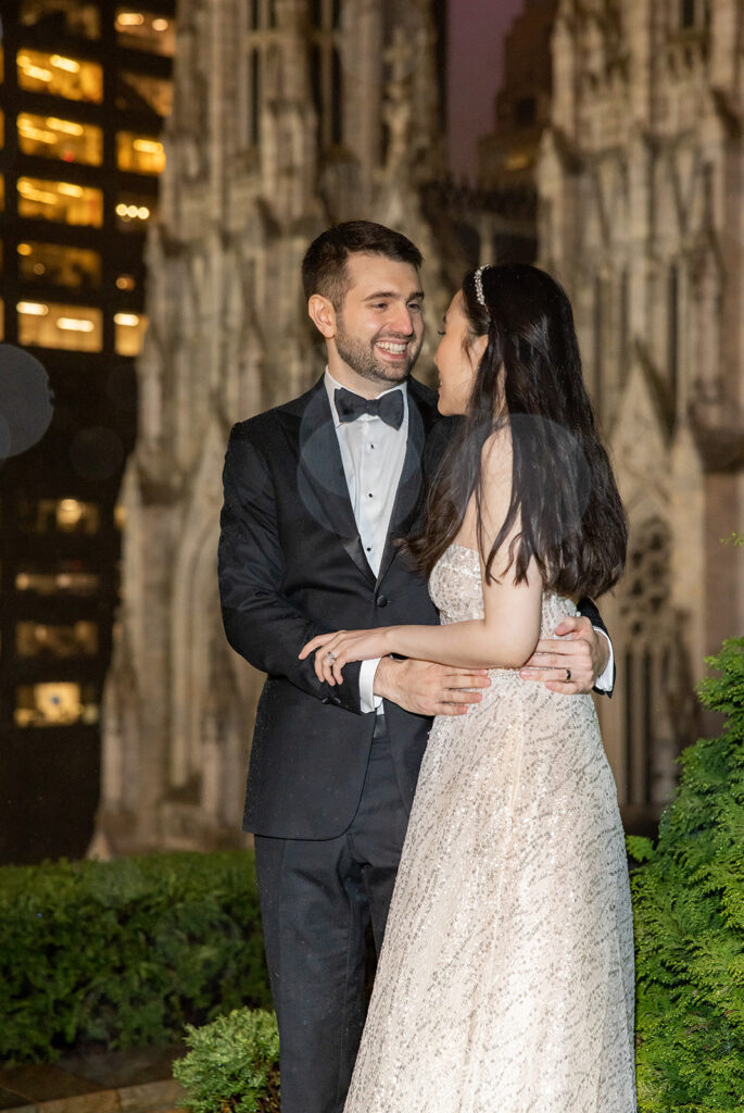 romantic nighttime rainy rooftop wedding portraits at 620 Loft and Garden