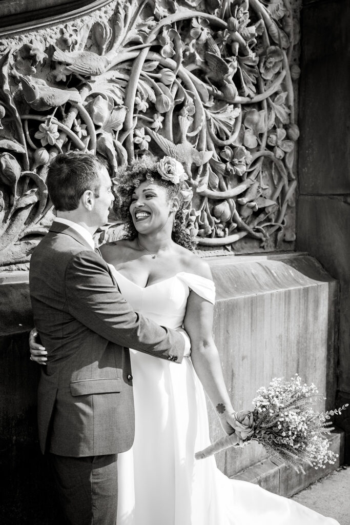 bride and groom walking around and enjoying themselves at bethesda fountain area in nyc