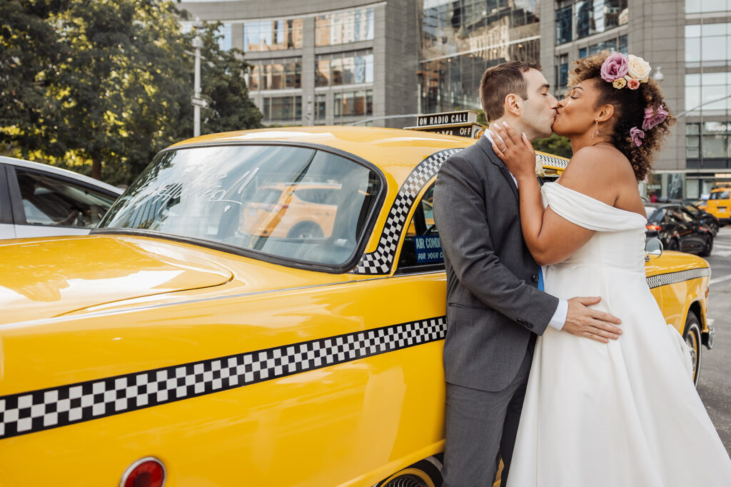 bride and groom kissing at the vintage cab in NYC