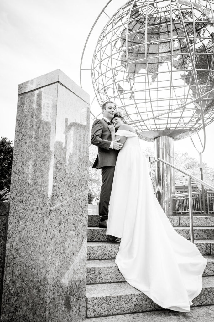 Bride and groom at the Columbus Circle with the giant globe structure