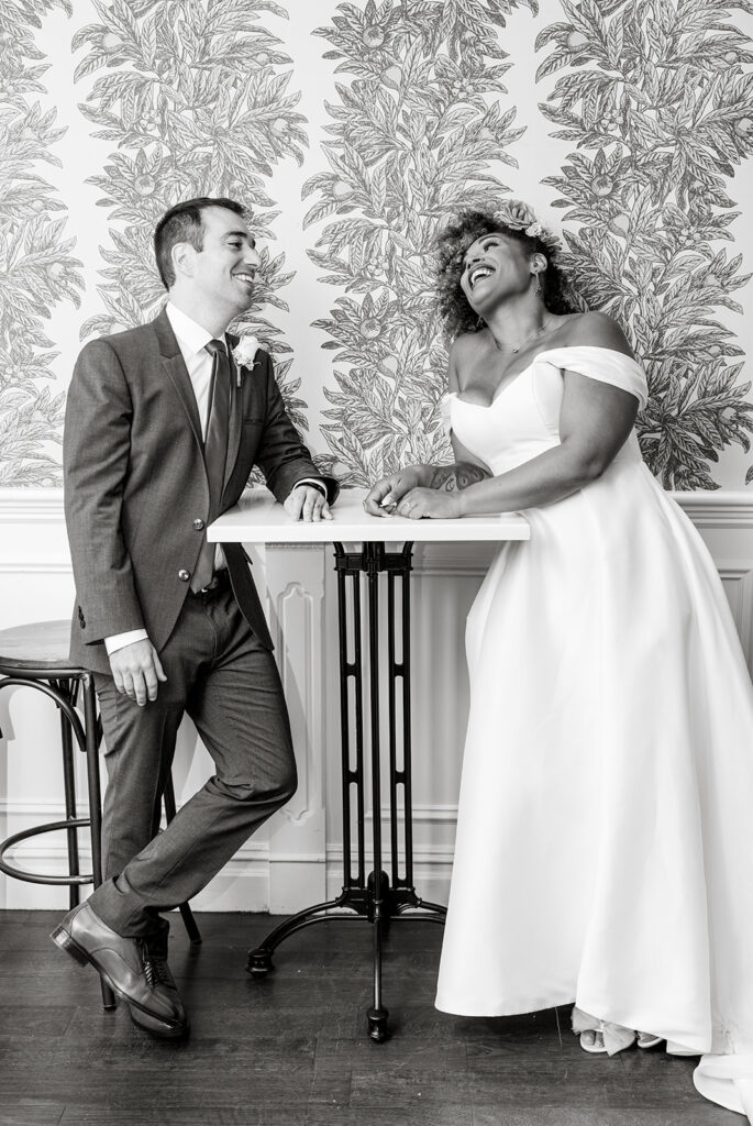 joyful bride and groom enjoying a drink during their nyc elopement at Sundry