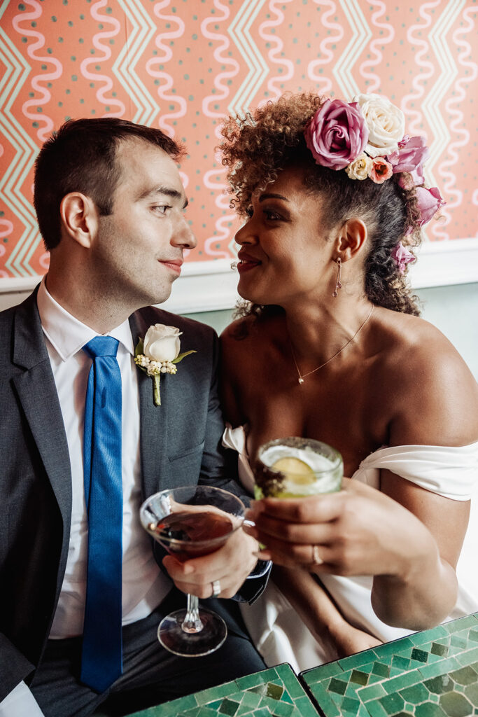 joyful bride and groom enjoying a drink during their nyc elopement at Sundry