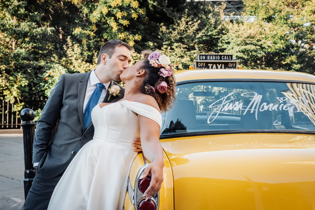 bride and groom kissing at the vintage cab in NYC