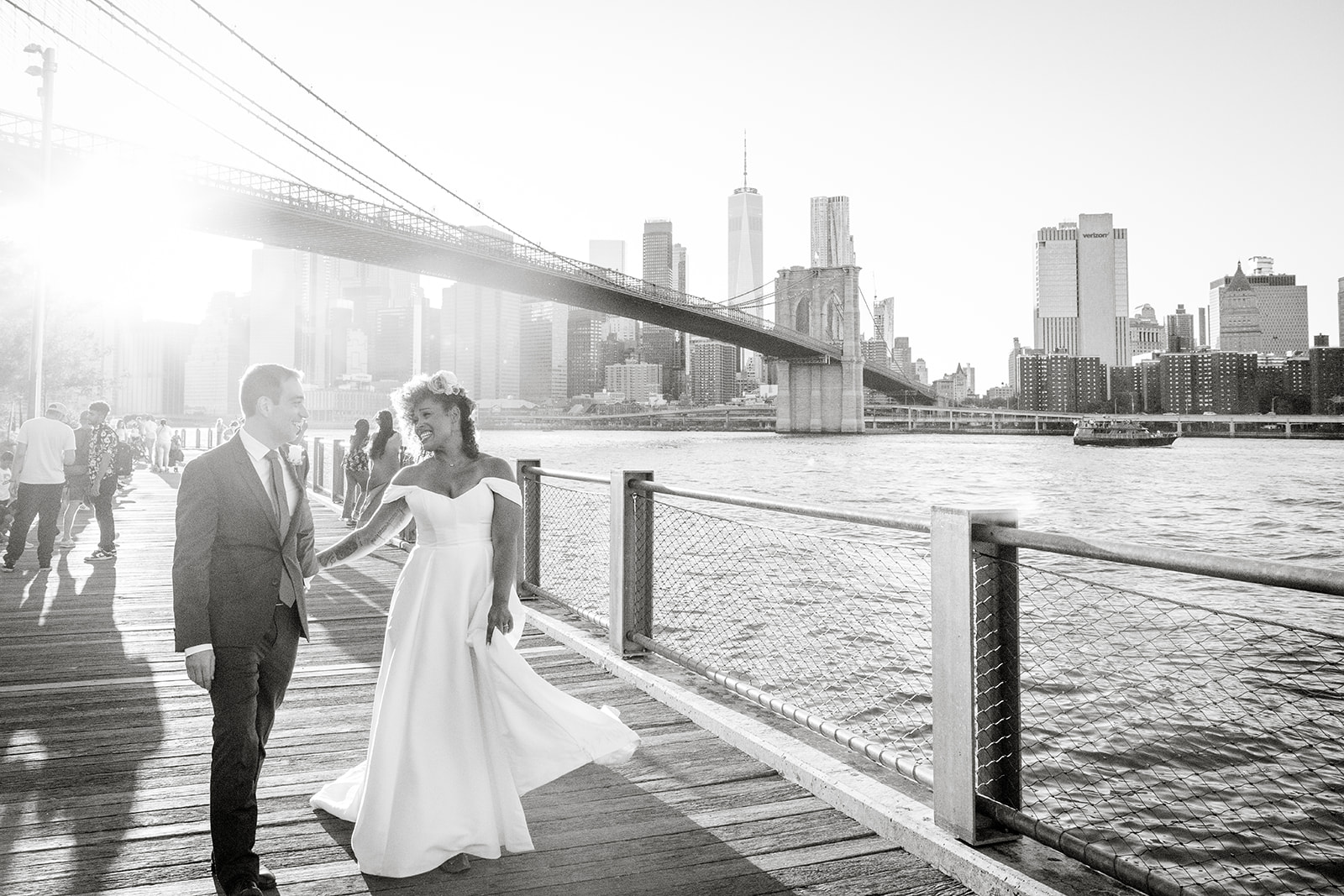 bride and groom strolling hand in hand in DUMBO, NYC