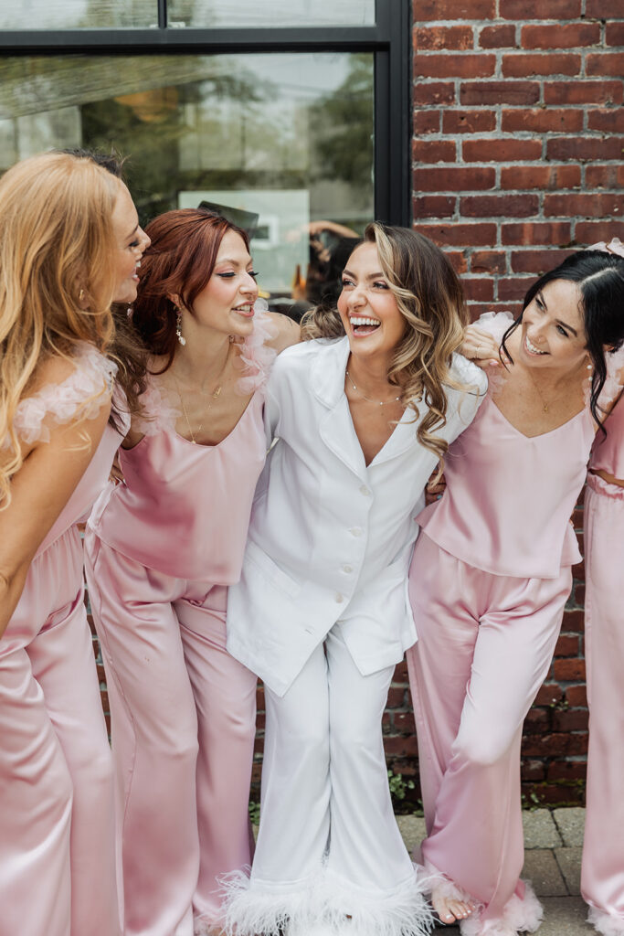 bride and bridesmaids in cute satin PJs before the big day