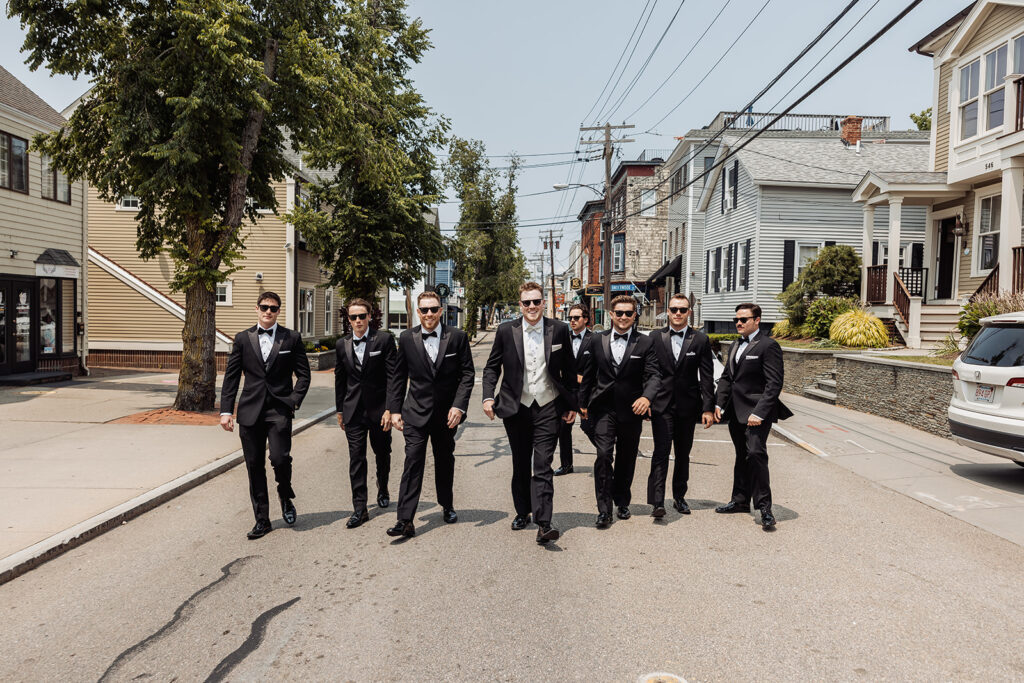 groom and groomsmen strolling through the Newport streets