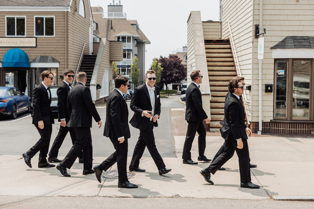 groom and groomsmen strolling through the Newport streets