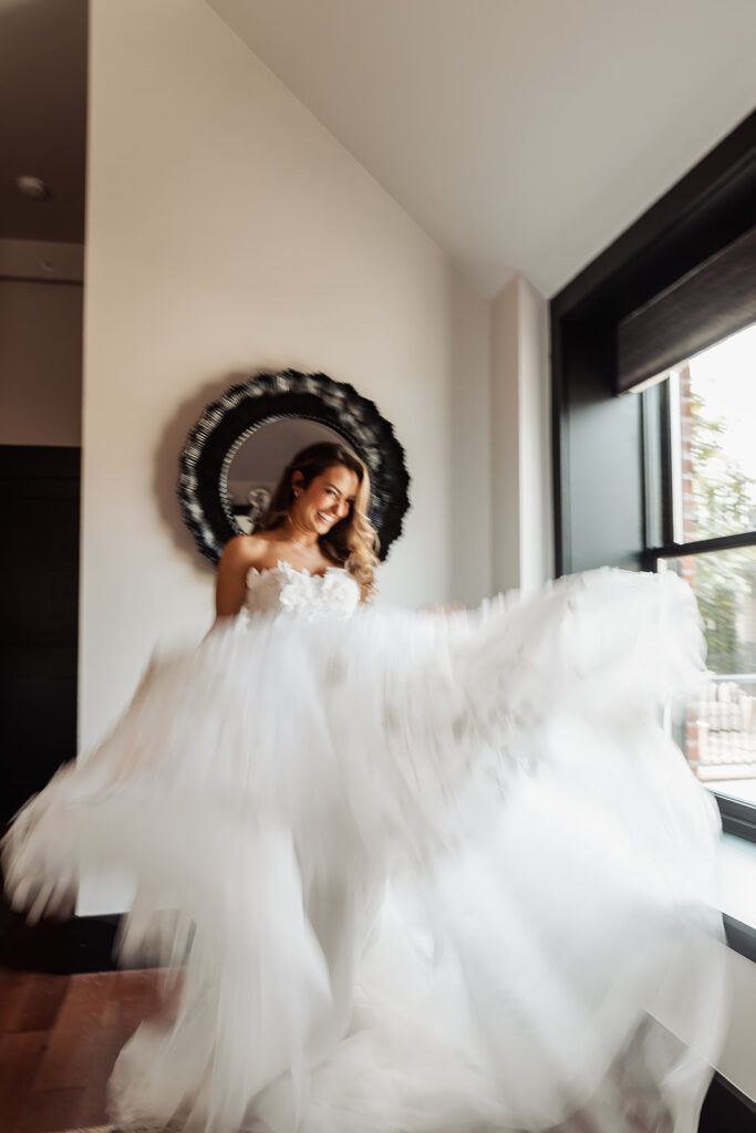 a motion blur of the bride spinning around in her dress