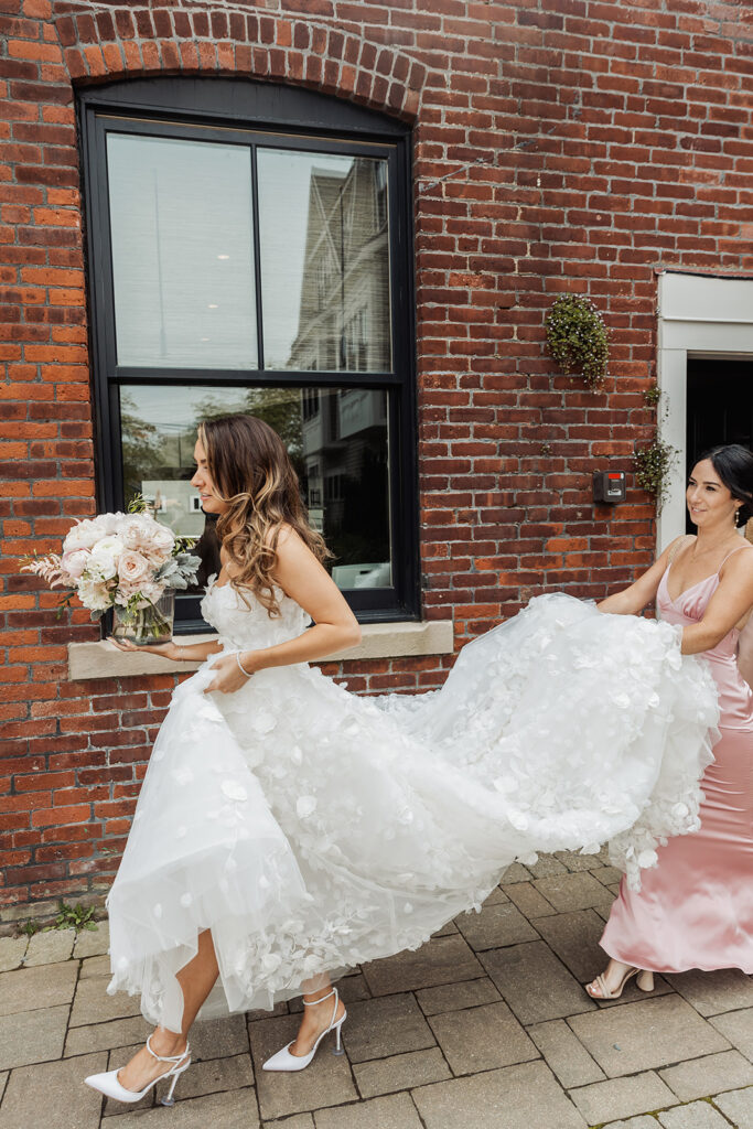 bride and bridesmaids strolling through the newport streets to head to the trolley