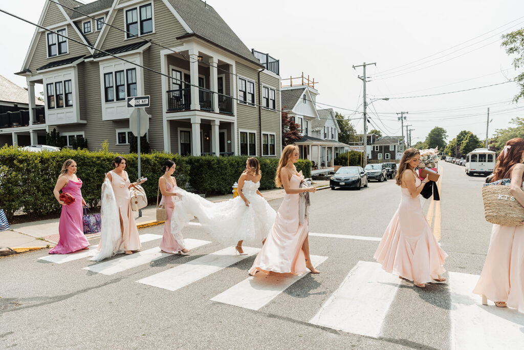 bride and bridesmaids strolling through the newport streets to head to the trolley