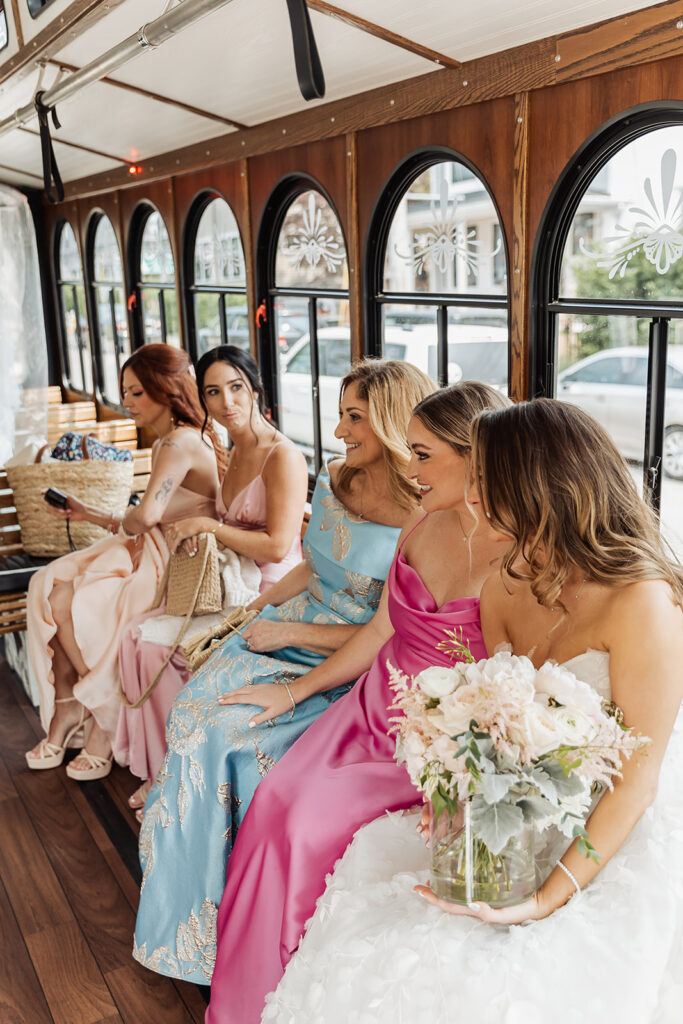 bride and bridesmaids in the trolley