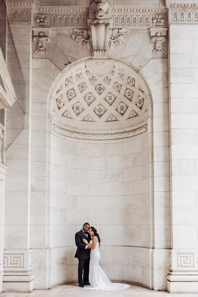 bride and groom in front of the new york public library during their nyc elopement day