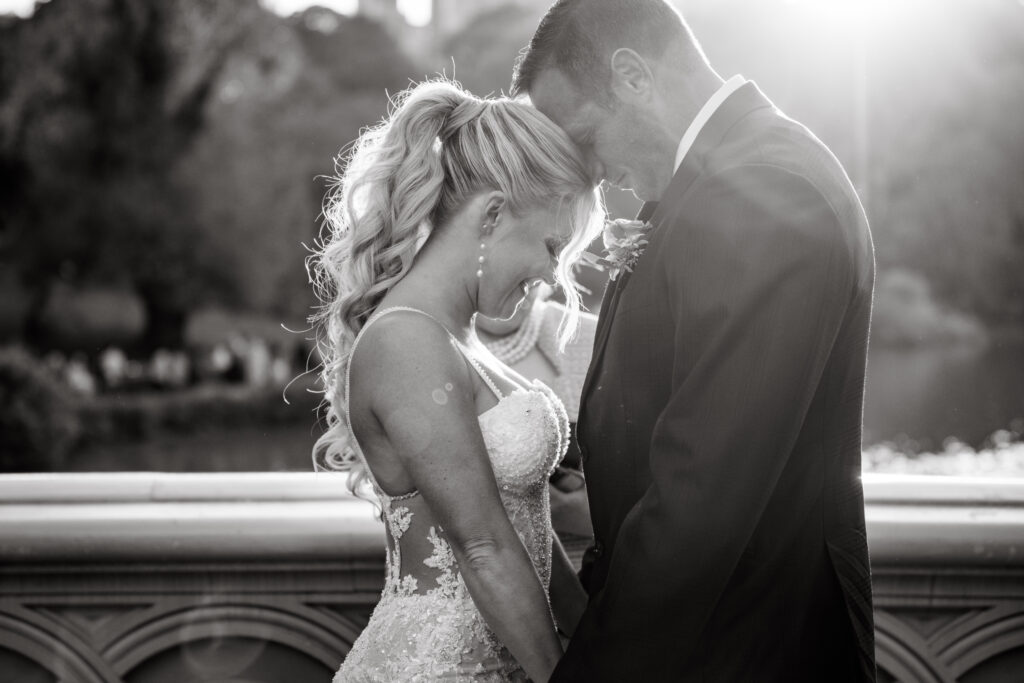 playful bride and groom moments on bow bridge during their nyc elopement